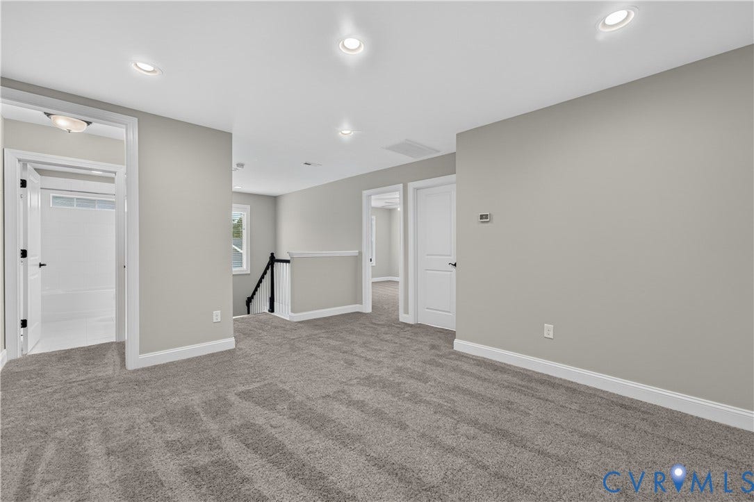 7238 Shenfield Avenue, Minutes To Short Pump, Glen Allen, VA 23059 Spacious carpeted room featuring recessed lighting, a window with natural light, white trim, and a white interior door