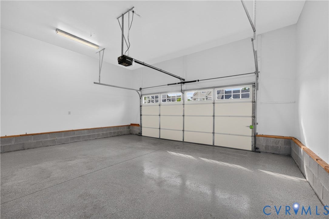 7238 Shenfield Avenue, Minutes To Short Pump, Glen Allen, VA 23059 Bright garage space with a light-toned, sectional garage door featuring upper window panels