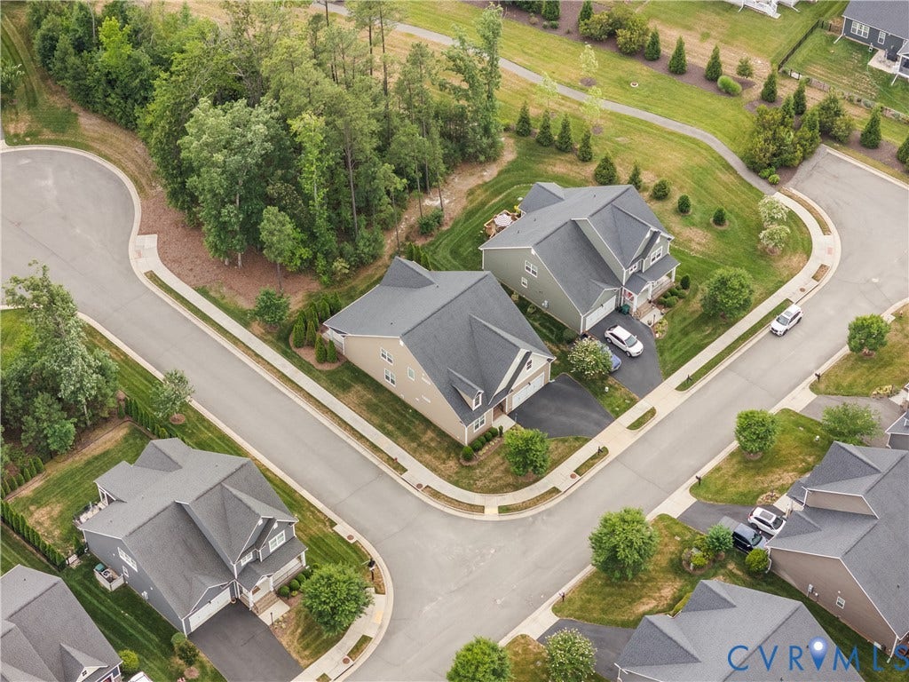 7238 Shenfield Avenue, Minutes To Short Pump, Glen Allen, VA 23059 Aerial perspective showcasing a residential street with multiple homes, mature trees, and a paved walking path