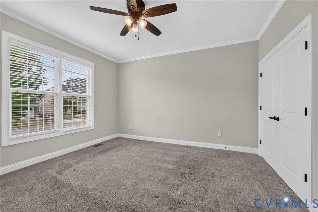 7238 Shenfield Avenue, Minutes To Short Pump, Glen Allen, VA 23059 Spacious room featuring neutral carpeting, a multi-pane window with blinds, and a ceiling fan with integrated lighting