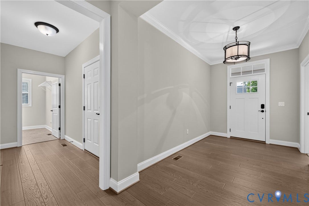 7238 Shenfield Avenue, Minutes To Short Pump, Glen Allen, VA 23059 Entryway featuring wood-finish flooring, crown molding, and a decorative pendant light fixture