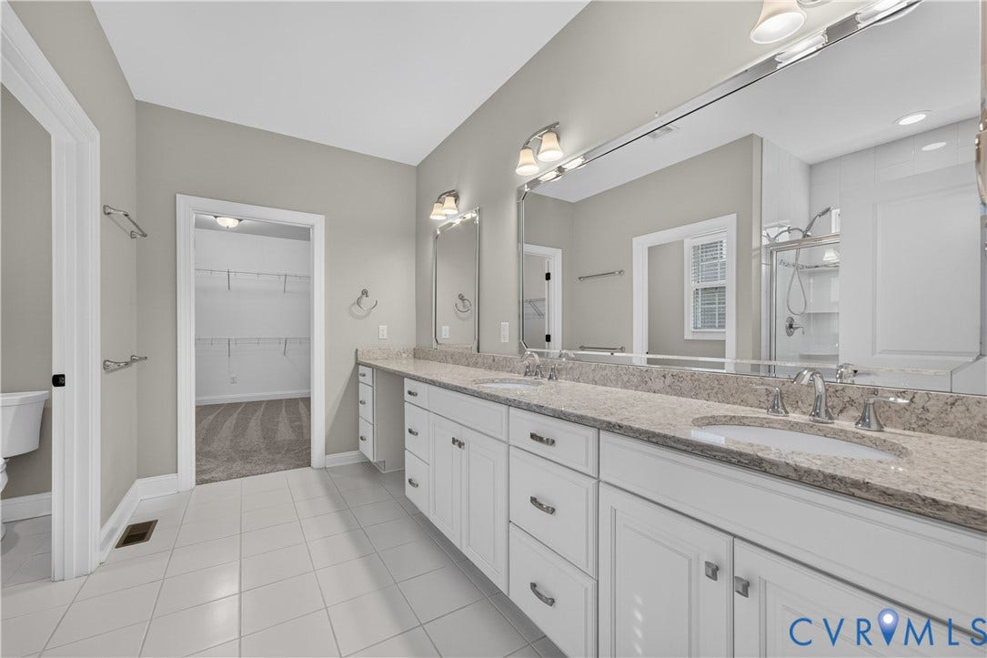 7238 Shenfield Avenue, Minutes To Short Pump, Glen Allen, VA 23059 Bathroom featuring dual vanities, white cabinetry, and stone-finish countertops
