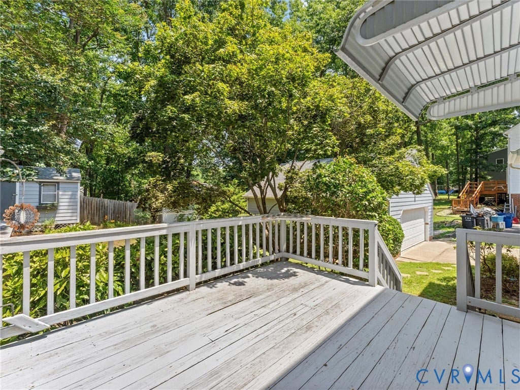 Spacious outdoor deck with white painted railings