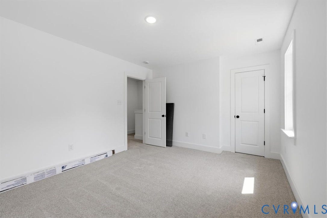 654 Frenchs Store Road, Cumberland, VA 23040 Neutral-toned carpeting complements the white walls and trim, with recessed lighting providing illumination