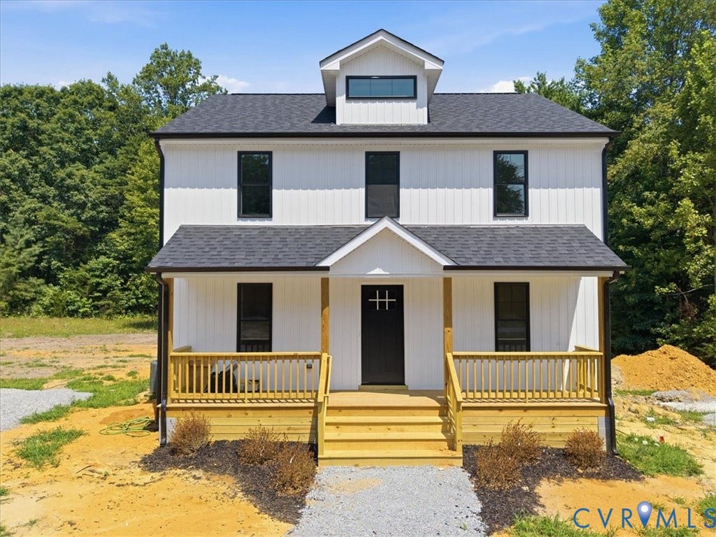 654 Frenchs Store Road, Cumberland, VA 23040 Modern farmhouse exterior featuring white board and batten siding, black-framed windows, a covered front porch with natural wood accents, a black entry door, and a dormer window