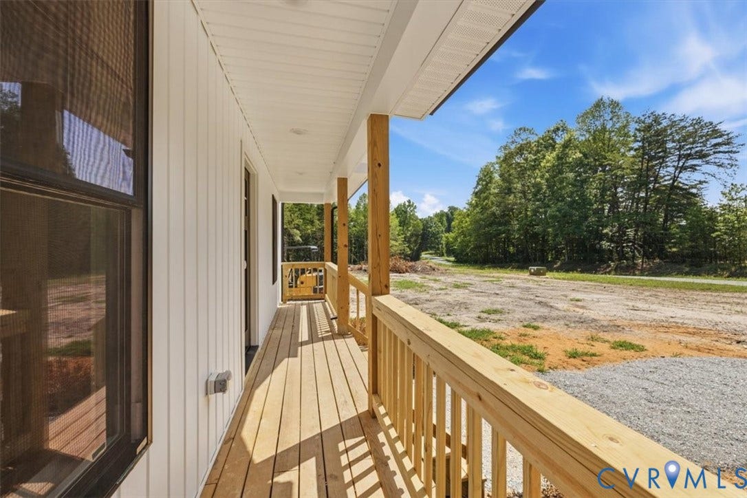 654 Frenchs Store Road, Cumberland, VA 23040 Front porch featuring natural wood flooring, wood railings, and wood support posts