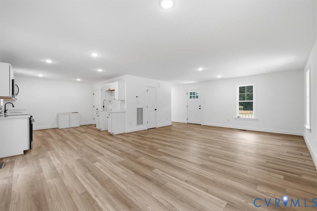 654 Frenchs Store Road, Cumberland, VA 23040 Open-concept living space featuring wood-finish flooring, recessed lighting, and white walls