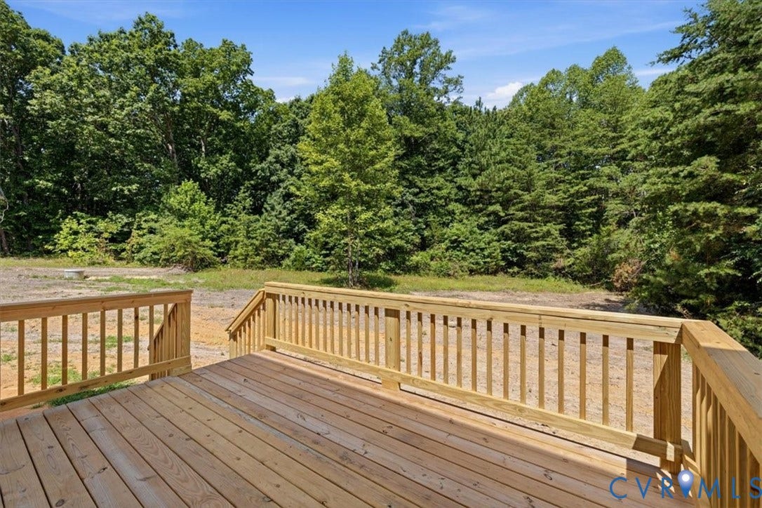 654 Frenchs Store Road, Cumberland, VA 23040 New wooden deck with railings overlooking a wooded landscape