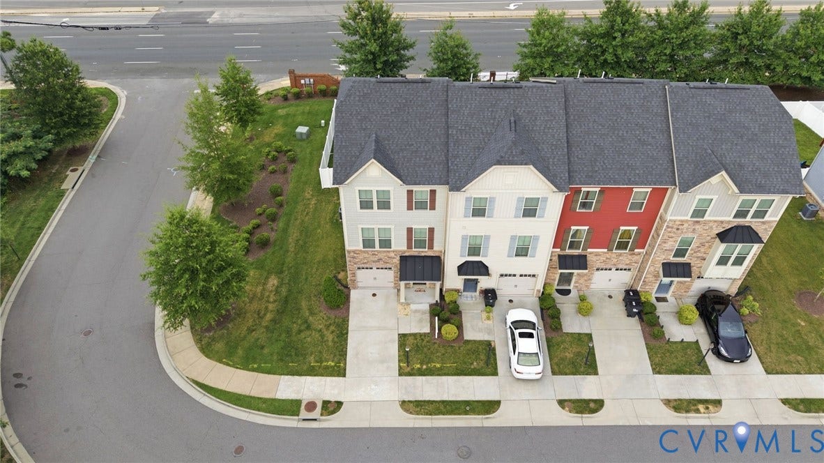 4101 New Hermitage Drive, Henrico, VA 23228 Row of modern townhomes featuring individual garages and private driveways