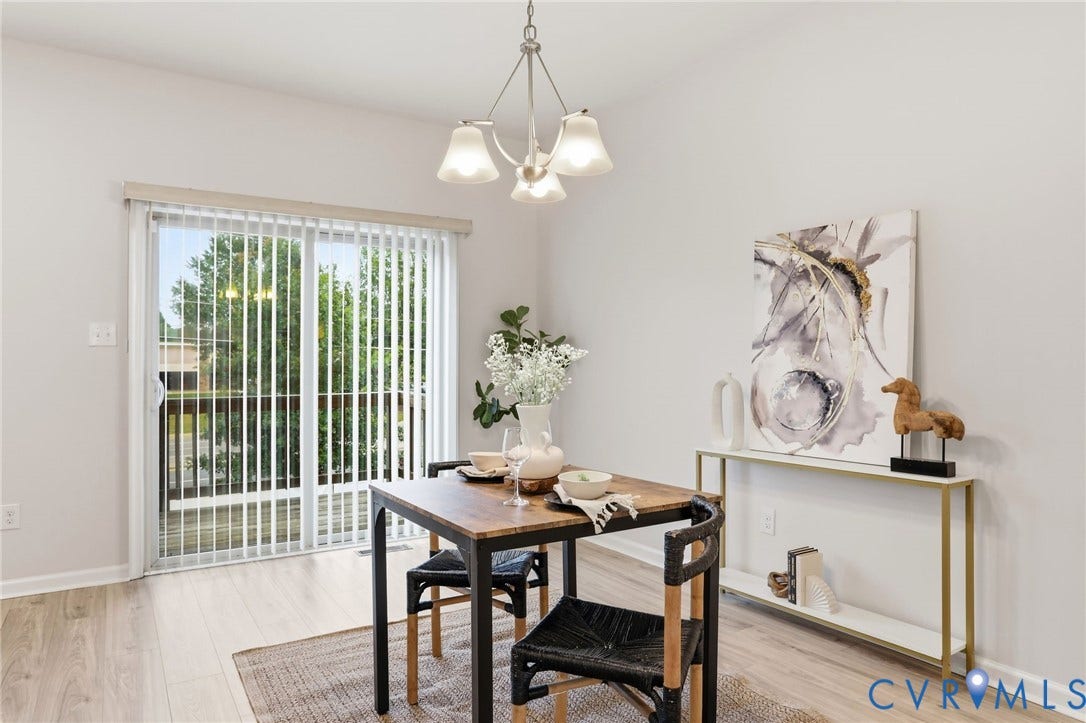 4101 New Hermitage Drive, Henrico, VA 23228 Dining area featuring wood-finish flooring and a contemporary chandelier