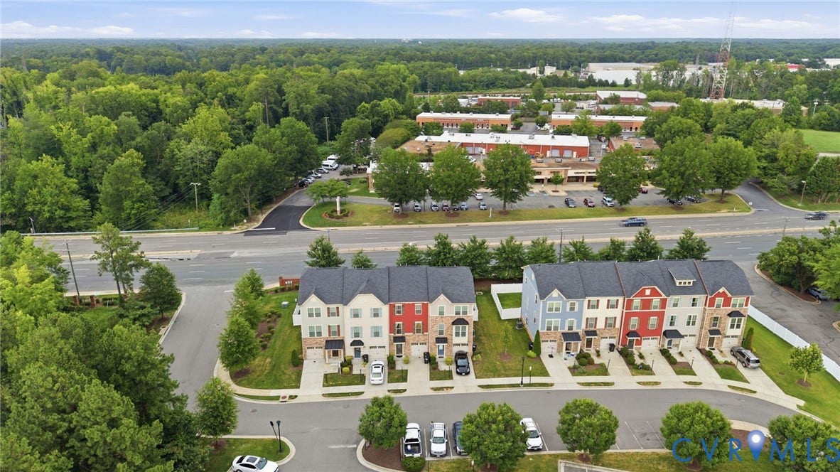 4101 New Hermitage Drive, Henrico, VA 23228 Aerial perspective showcasing a row of townhomes with varied exterior finishes