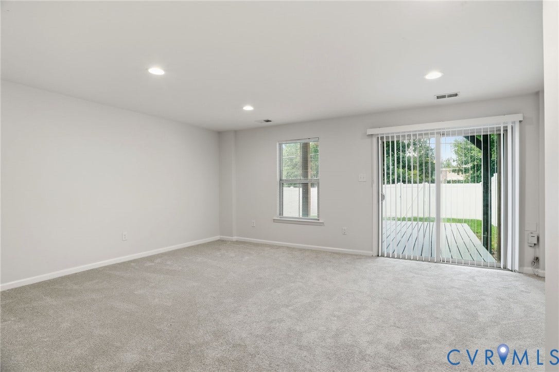 4101 New Hermitage Drive, Henrico, VA 23228 Spacious room with light gray carpeting, recessed ceiling lighting, and a window with white trim