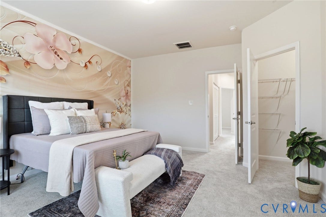 4101 New Hermitage Drive, Henrico, VA 23228 Spacious bedroom featuring light grey carpeting and a decorative accent wall