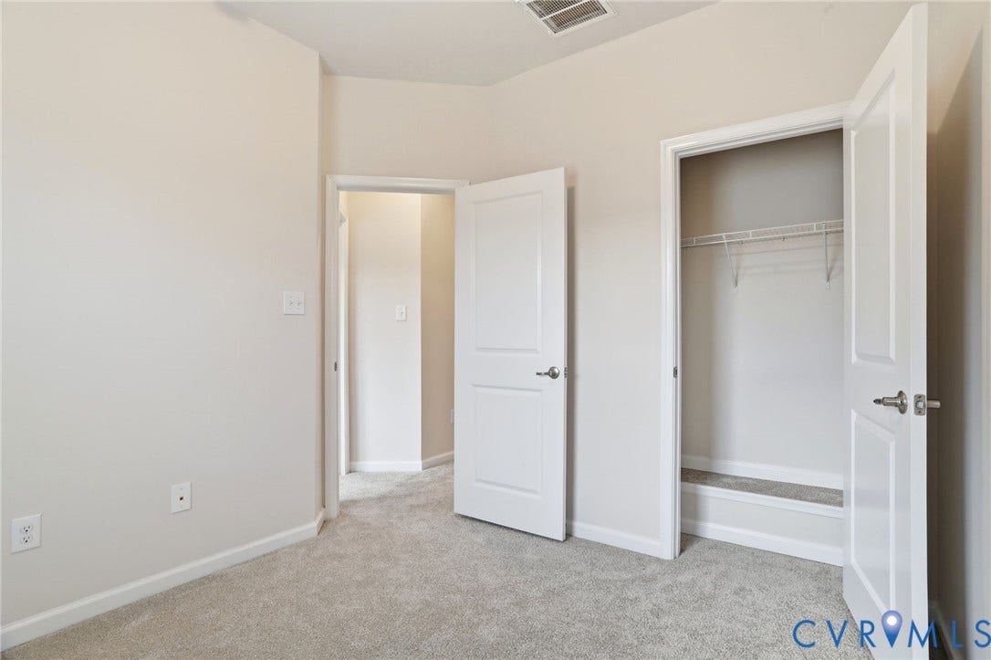 4101 New Hermitage Drive, Henrico, VA 23228 Carpeted interior room featuring light gray walls, white trim, and a white interior door
