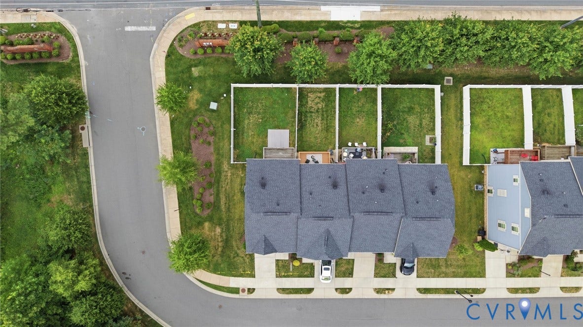 4101 New Hermitage Drive, Henrico, VA 23228 Aerial view showcasing multiple residential structures with dark grey shingle roofs
