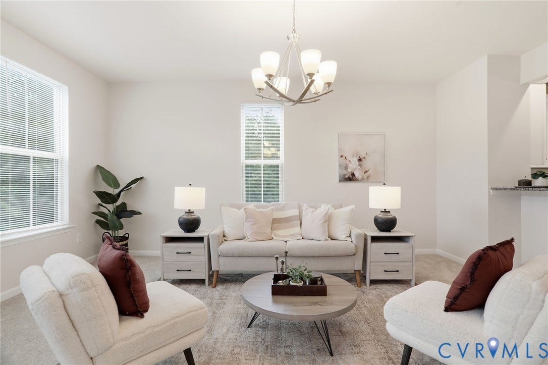 4101 New Hermitage Drive, Henrico, VA 23228 Open-concept living space featuring neutral paint, multiple windows, a decorative chandelier, and recessed lighting