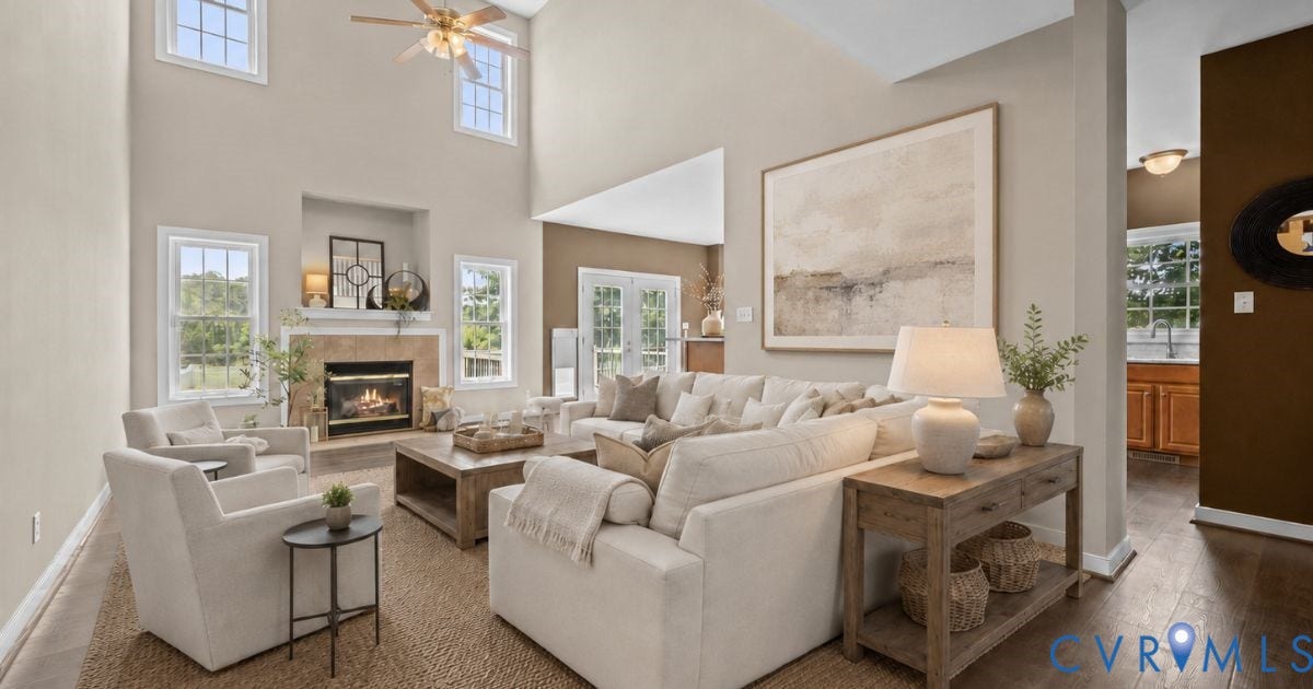 Vaulted ceiling with a ceiling fan, gas fireplace with a stone surround, French doors, wood-finish flooring, and recessed lighting