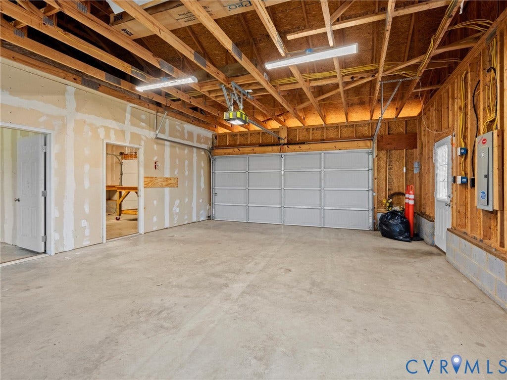DETACHED GARAGE WITH 2 ROOMS WITH MINI SPLITS AND GARAGE AREA FOR CARS