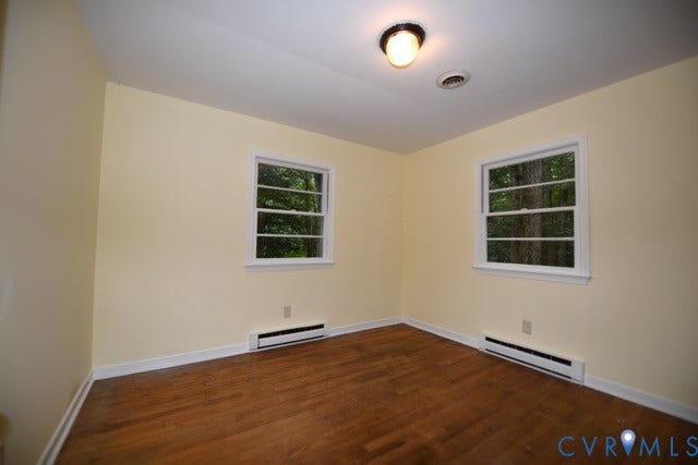 12720 Bailey Bridge Road, Bailey Bridge, Midlothian, VA 23112 Room featuring wood-finish flooring, white trim, built-in closet and two windows