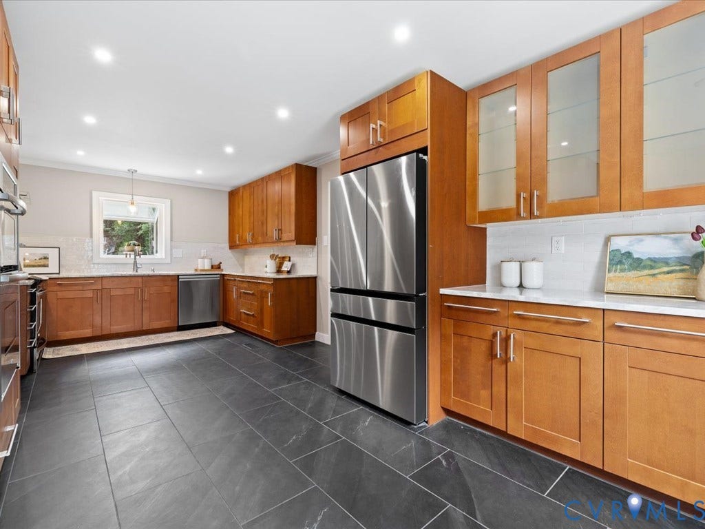 9630 Goneway Drive, Henrico, VA 23238 An abundance of cabinetry, counter space & storage makes this kitchen as functional as it is impressive. The 2025 refrigerator conveys!