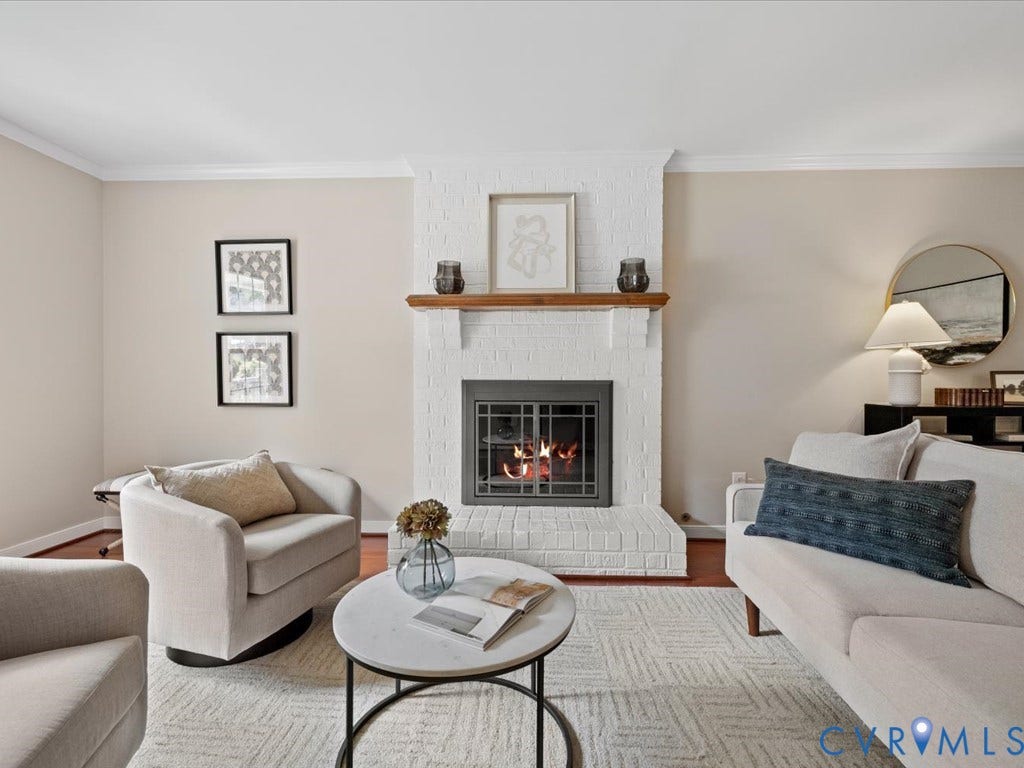 9630 Goneway Drive, Henrico, VA 23238 Bright living room just off the foyer. Brick fireplace converted to gas. Fireplace flames are AI