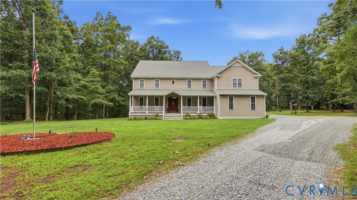 1836 Rocky Ford Road, Powhatan, VA 23139 Two-story residence featuring a covered front porch with white columns, light-colored siding, and a gabled roof