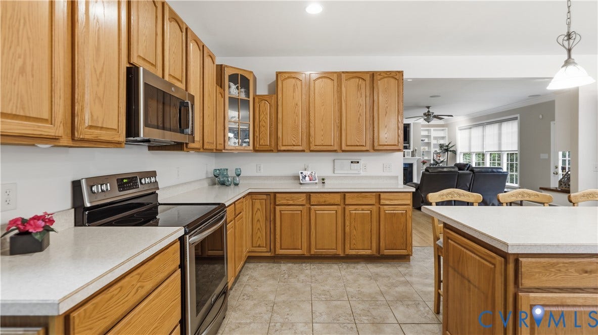1836 Rocky Ford Road, Powhatan, VA 23139 Kitchen featuring wood-finish cabinetry, stainless steel appliances, and a built-in microwave