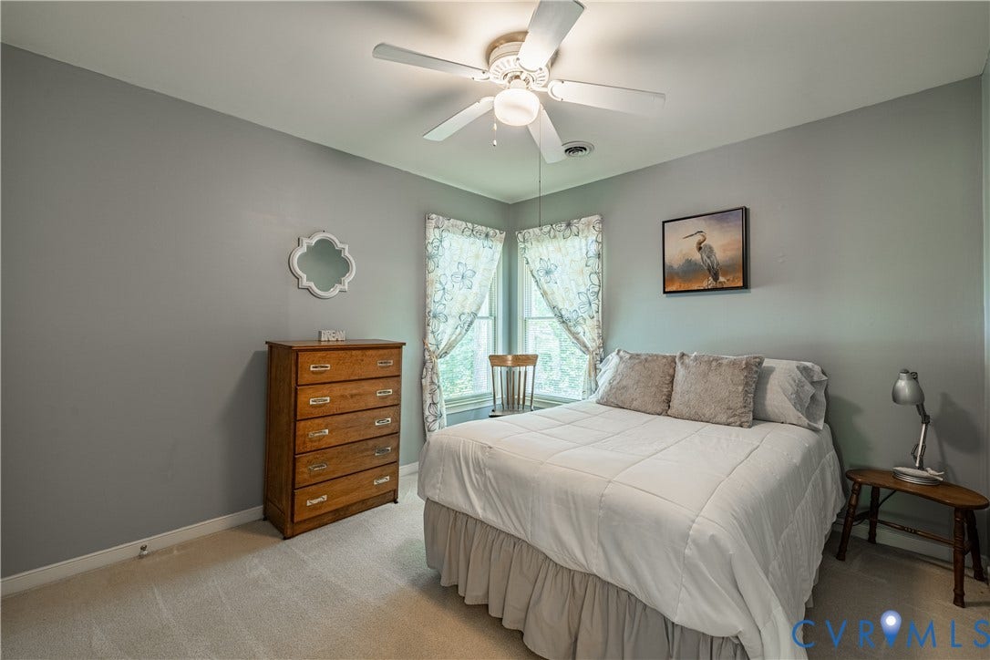 Carpeted room with light gray wall color