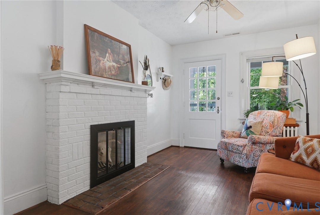 3332 Parkwood Avenue, Carytown, Richmond, VA 23221 White-painted brick fireplace with a black firebox and mantle