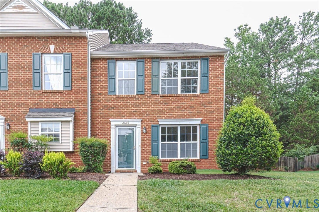 2802 Goyne Terrace, Chester, VA 23831 Brick exterior featuring teal shutters and white window frames