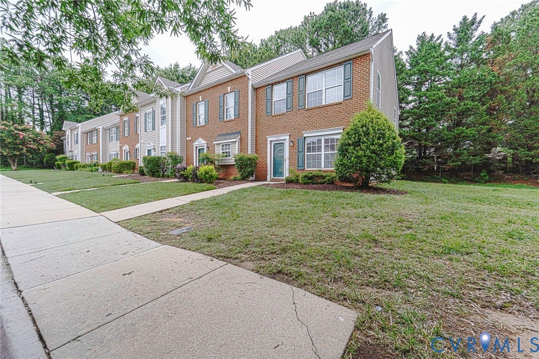 2802 Goyne Terrace, Chester, VA 23831 Brick facade townhome with a teal entry door
