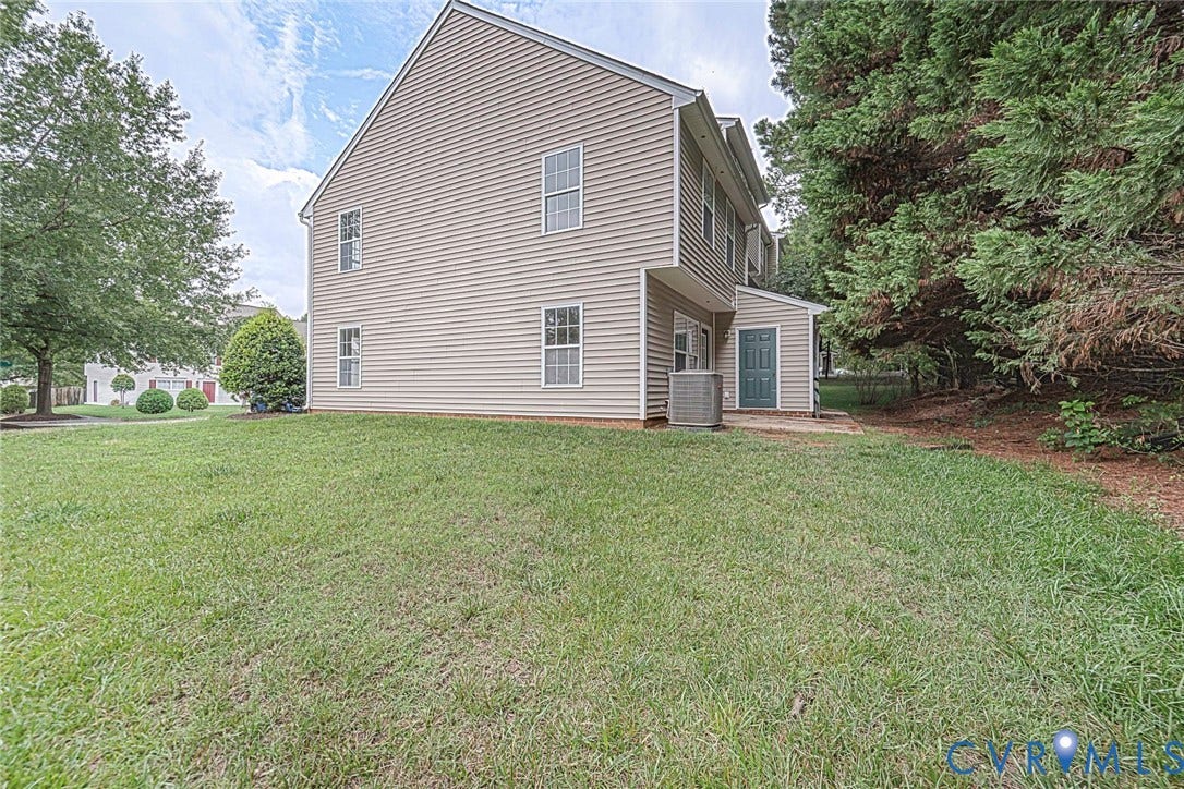 2802 Goyne Terrace, Chester, VA 23831 Expansive rear yard with a two-story beige siding exterior