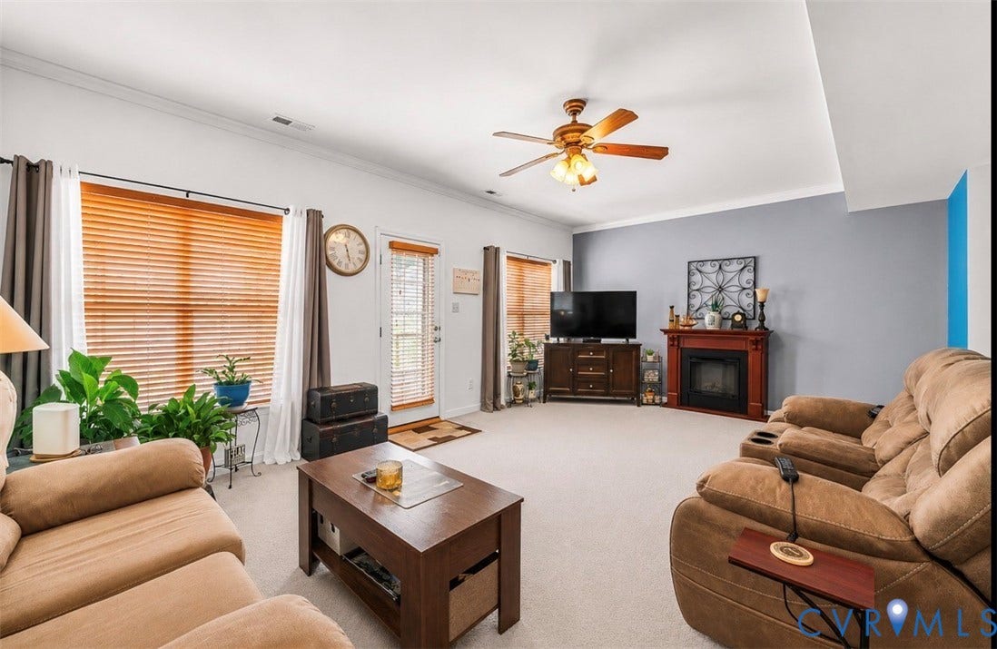 958 Wellston Court, Glen Allen, VA 23059 Spacious living area featuring light-toned carpeting and a ceiling fan with integrated lighting