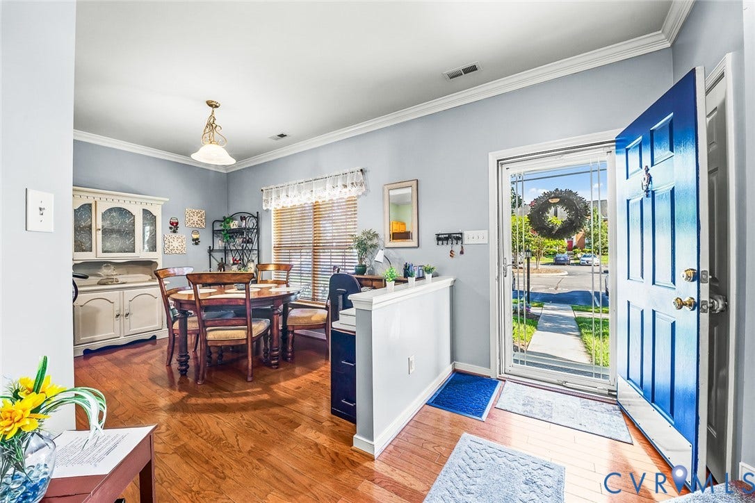 958 Wellston Court, Glen Allen, VA 23059 Entryway opens to a dining space featuring wood-finish flooring, light blue wall paint, and white crown molding