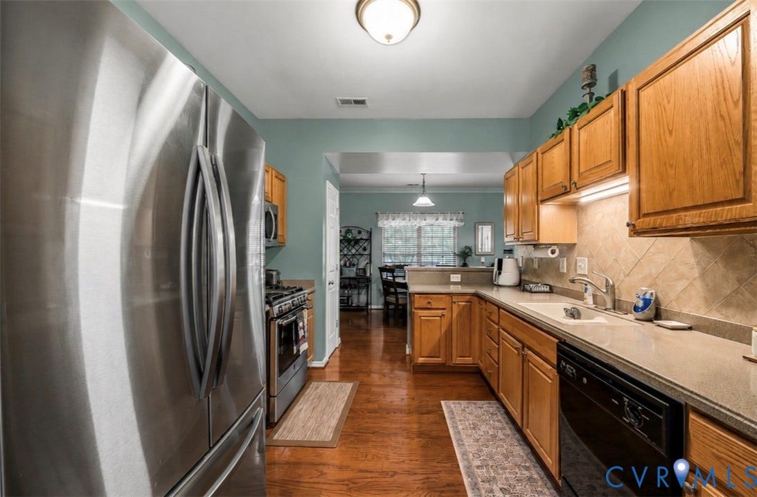 958 Wellston Court, Glen Allen, VA 23059 Kitchen with wood-finish flooring, stainless steel refrigerator, and wood cabinetry