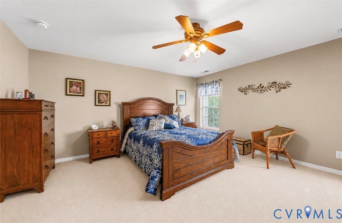 958 Wellston Court, Glen Allen, VA 23059 Spacious bedroom featuring light-colored carpeting, neutral painted walls, and a ceiling fan with integrated lighting