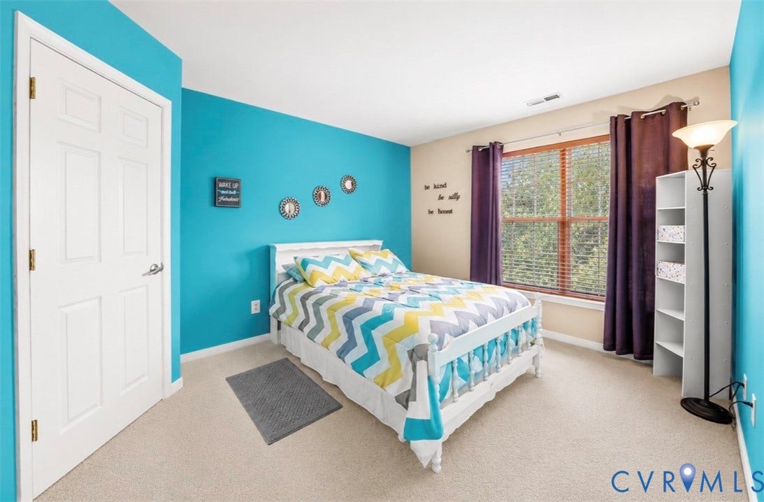 958 Wellston Court, Glen Allen, VA 23059 Carpeted bedroom featuring a six-panel door, a window with horizontal blinds, and accent walls
