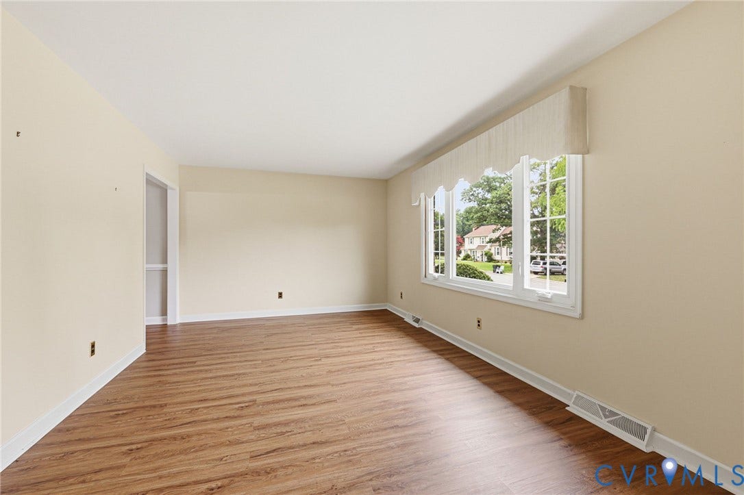 3737 Perthshire Lane, Colonial Heights, VA 23834 Spacious living room featuring wood-finish flooringand beautiful three panel window for lots of natural light