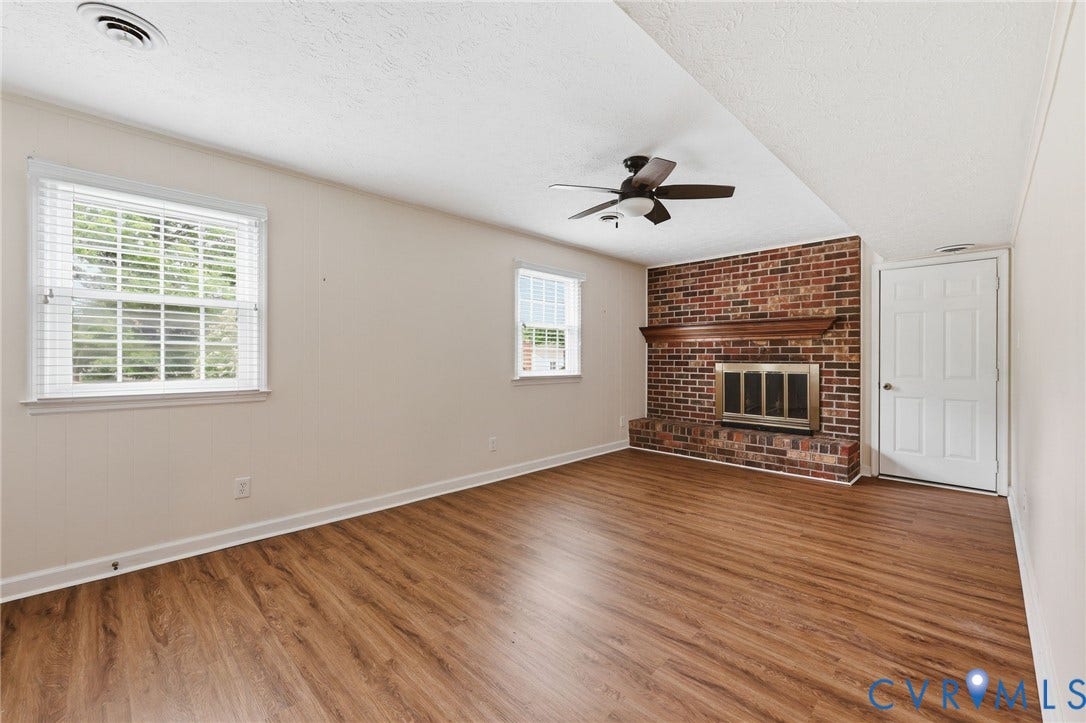 3737 Perthshire Lane, Colonial Heights, VA 23834 Family room on lower level with fireplace and door to the garage