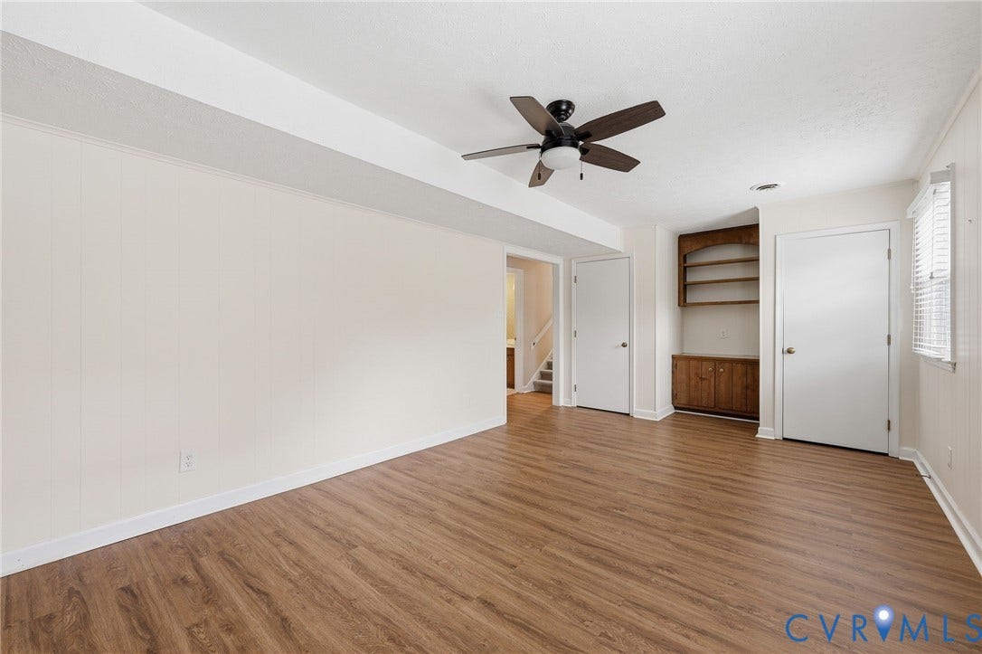 3737 Perthshire Lane, Colonial Heights, VA 23834 Family room with view to the hall and stairs has built-in bookcase, storage closet and utility closet