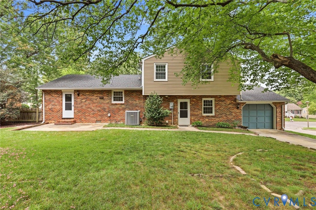 3737 Perthshire Lane, Colonial Heights, VA 23834 Backyard with patio off the dining room featuring shade from a mature maple tree