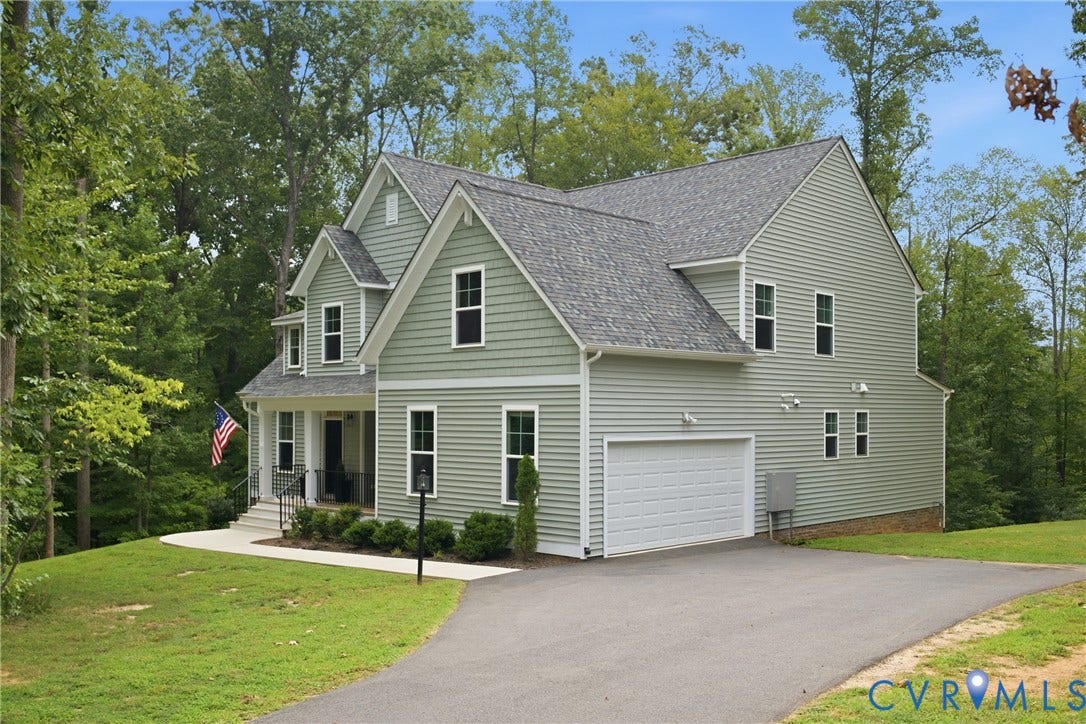 3780 Aston Trail, Powhatan, VA 23139 Two-story residence with light green siding and a gray shingle roof