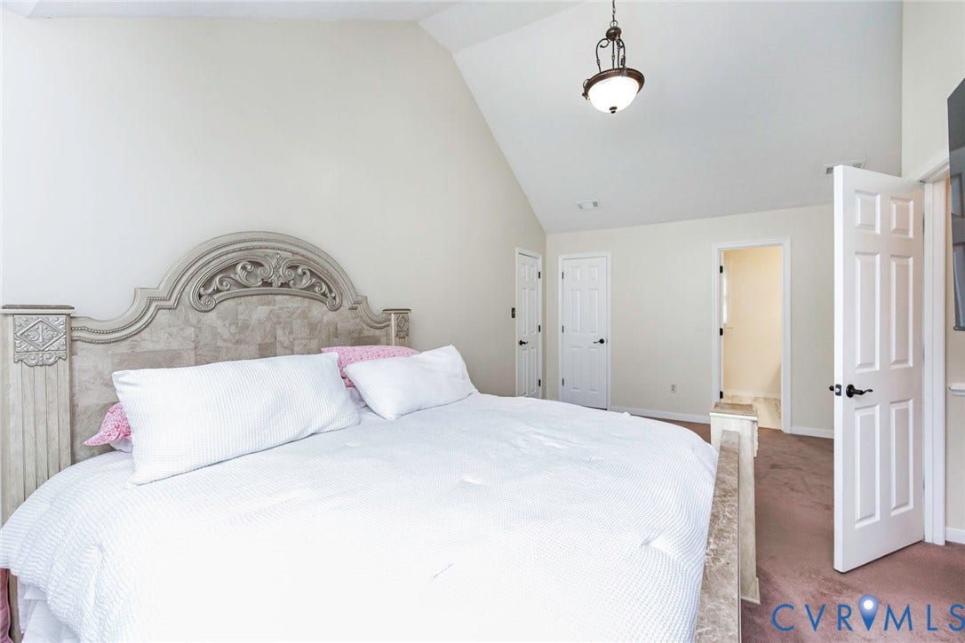 Vaulted ceilings with a hanging light fixture