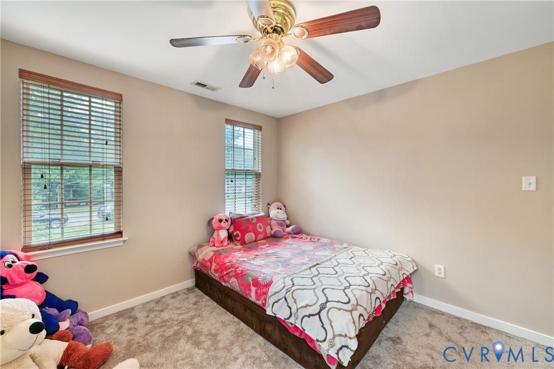 519 N Timber Tribe, Lake Anna, Mineral, VA 23117 Carpeted room with neutral wall tones and white baseboards