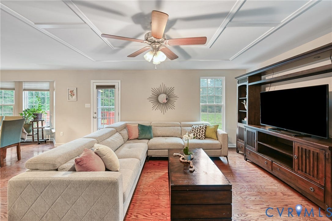 519 N Timber Tribe, Lake Anna, Mineral, VA 23117 Coffered ceiling with a ceiling fan, hardwood flooring, multiple windows, and a glass-paneled door