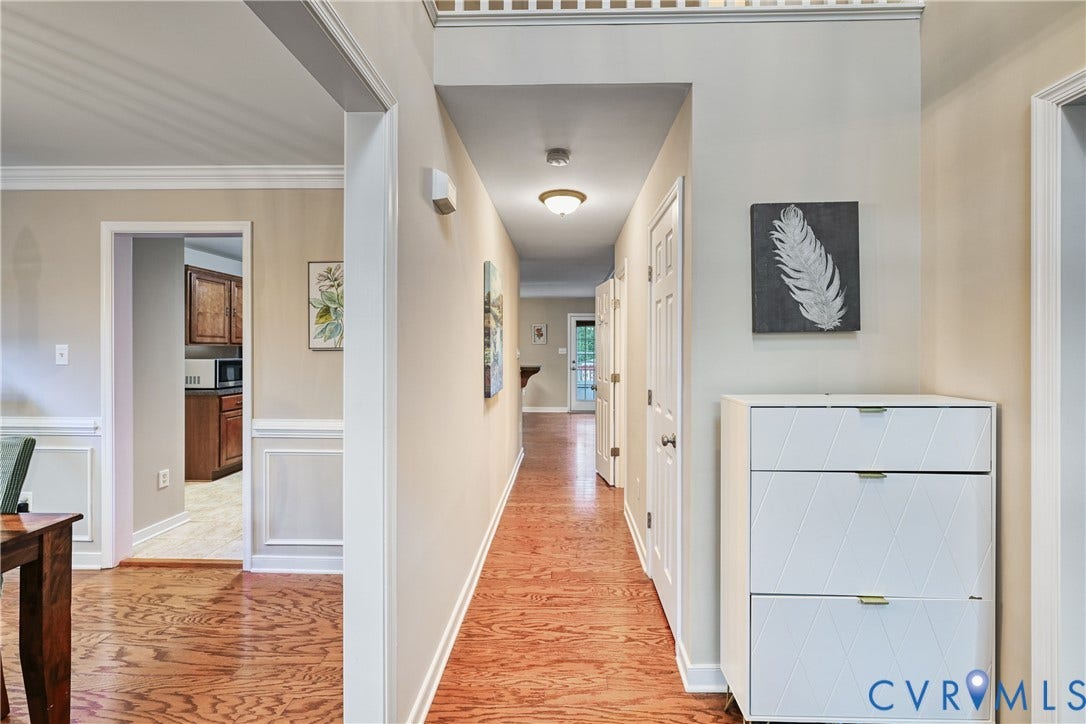 519 N Timber Tribe, Lake Anna, Mineral, VA 23117 Hardwood flooring extending through a central hallway with recessed lighting