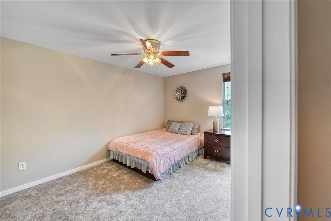 519 N Timber Tribe, Lake Anna, Mineral, VA 23117 Carpeted interior space featuring a ceiling fan with integrated lighting, neutral wall paint, and white trim