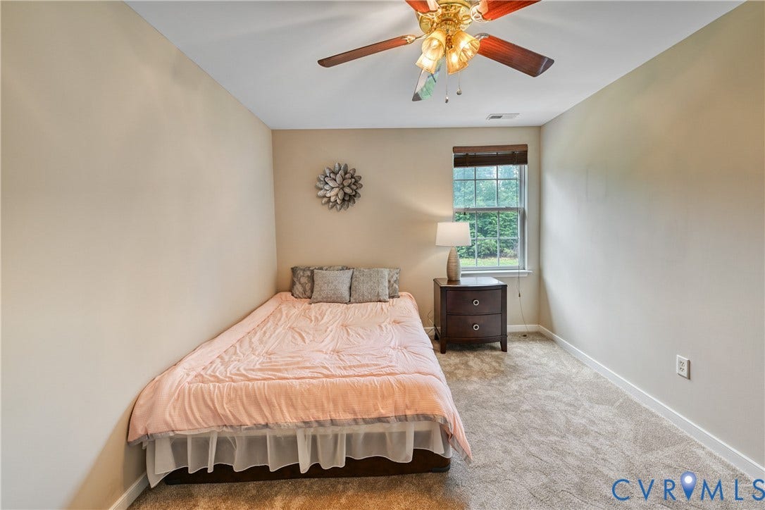 519 N Timber Tribe, Lake Anna, Mineral, VA 23117 Neutral-toned walls complement the textured gray carpeting