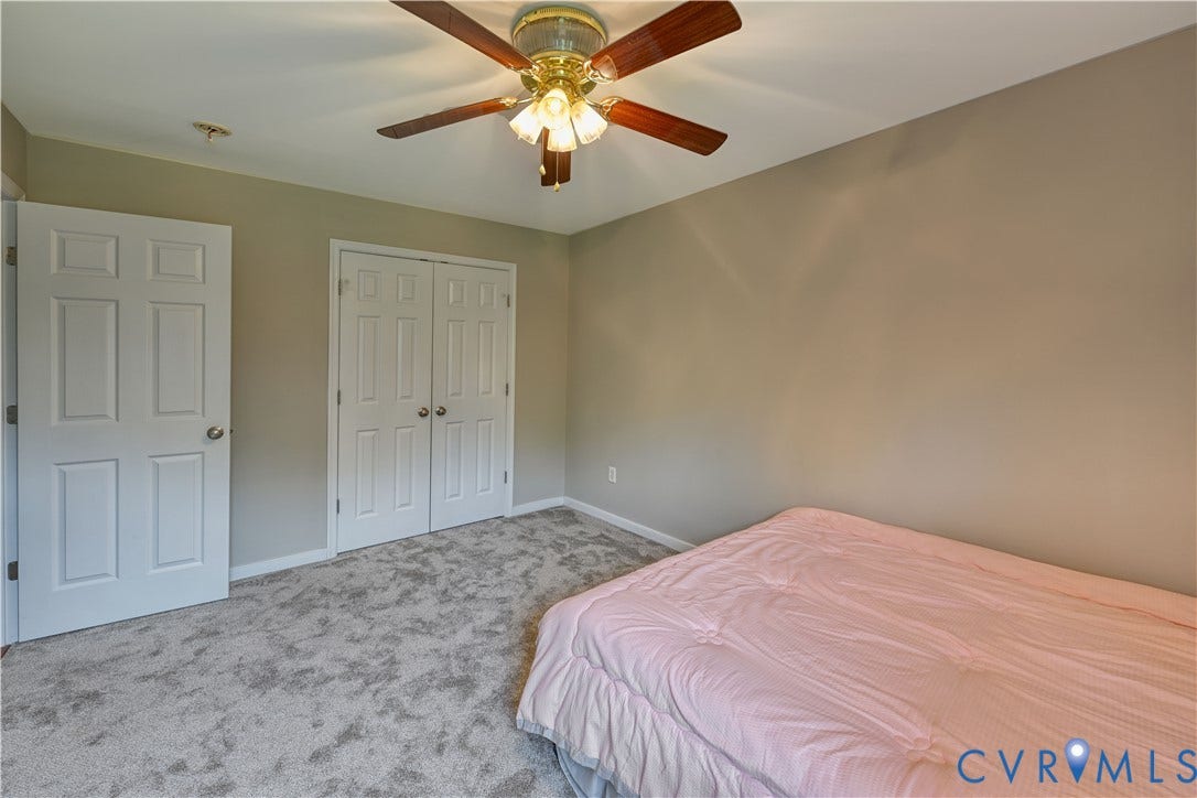519 N Timber Tribe, Lake Anna, Mineral, VA 23117 Carpeted room featuring a ceiling fan with light fixture, neutral wall paint, and white paneled doors