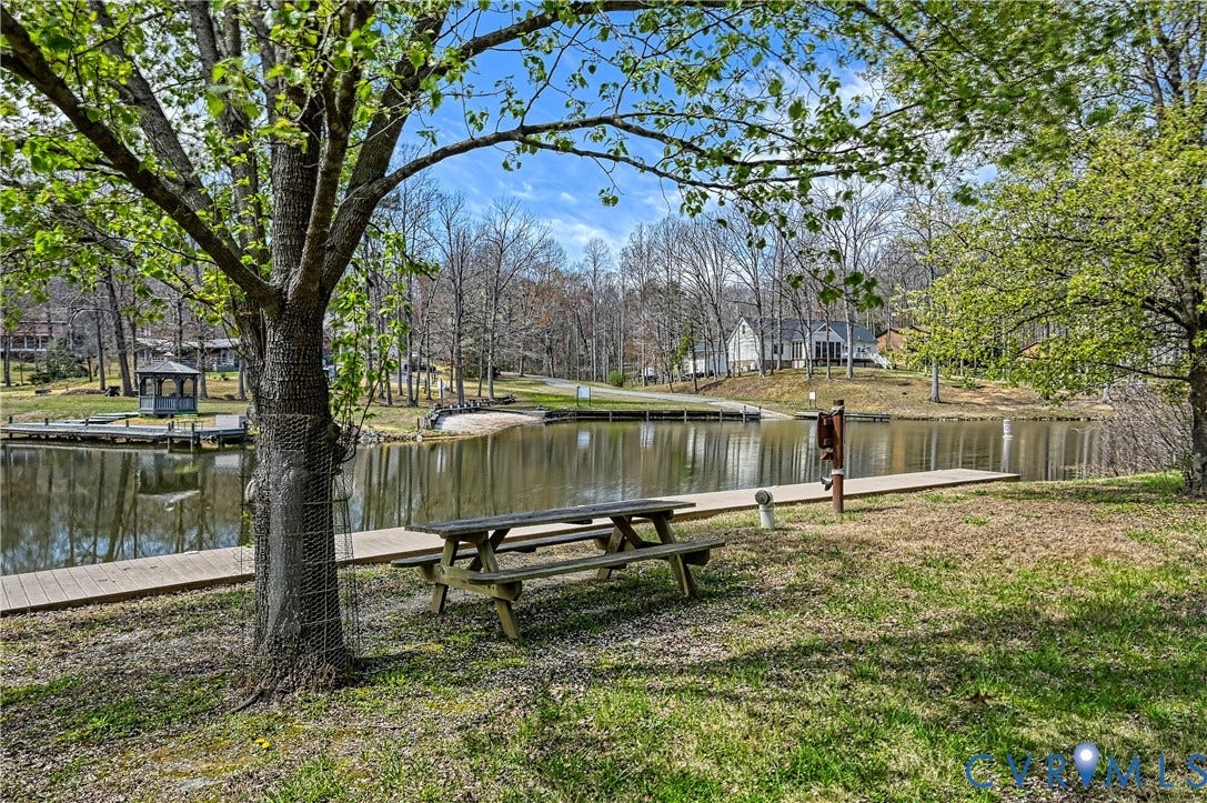519 N Timber Tribe, Lake Anna, Mineral, VA 23117 Bluewater Community featuring a wooden dock and a grassy shoreline